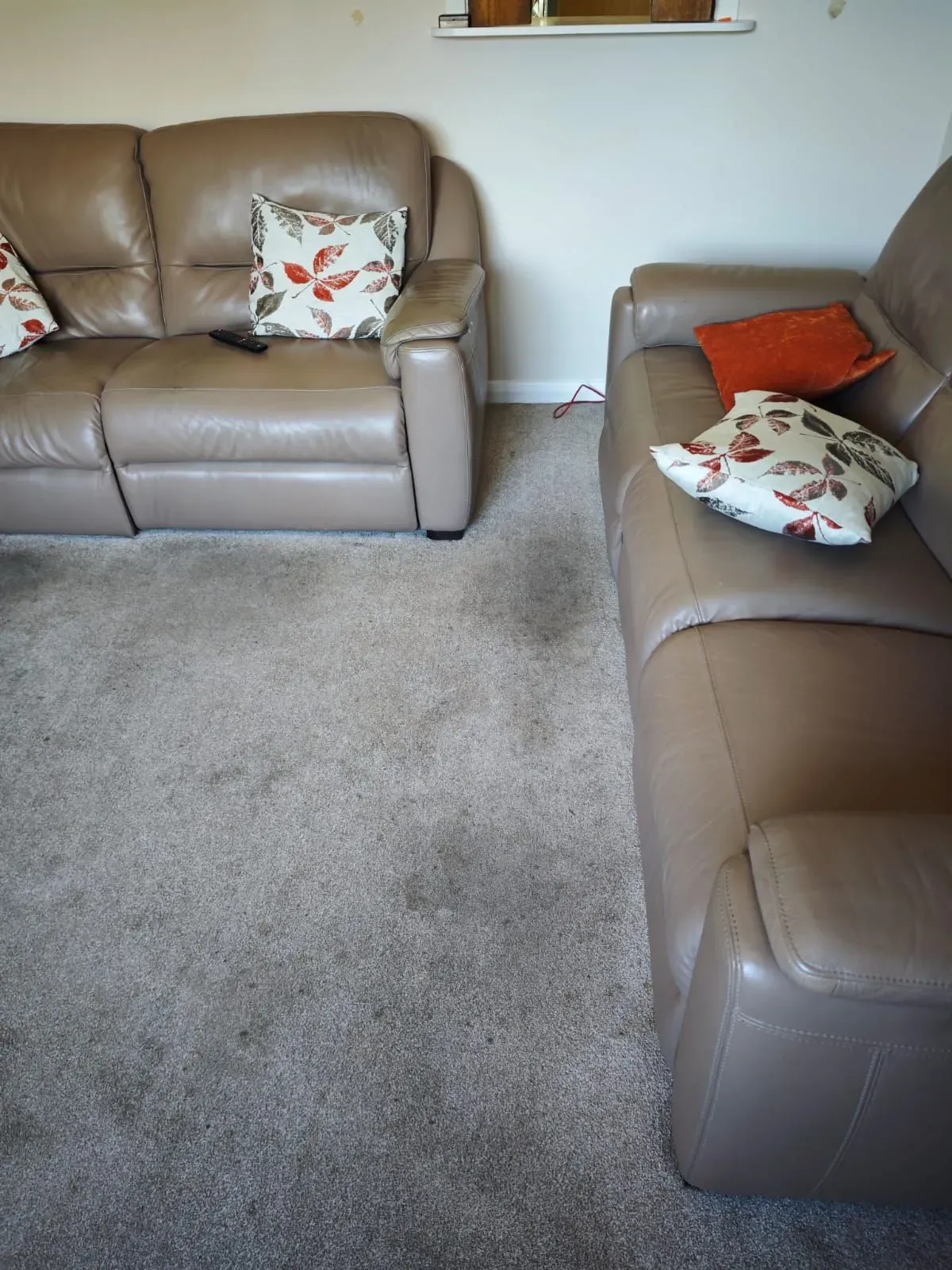 Before: living room carpet refreshed around the furniture